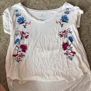 A white tee shirt with flower print